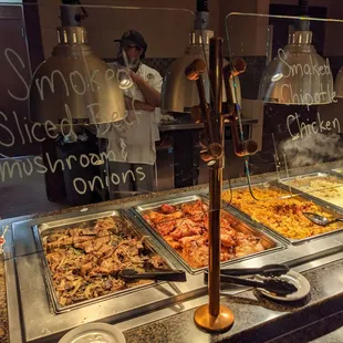 a buffet with a variety of food items