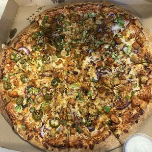 1/2 chicken tikka masala pizza and 1/2 butter chicken pizza