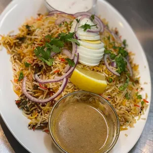 a plate of food with rice and vegetables