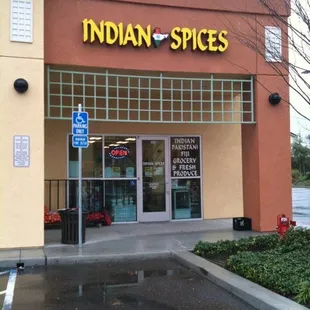 a storefront with a sign that says indian spices