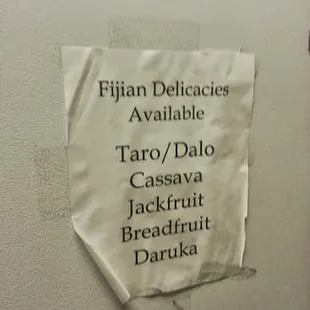 a sign on a refrigerator door