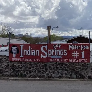 Sign on the road advertising the hot spring baths