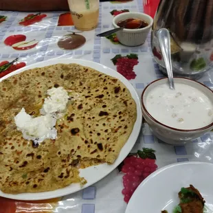 Aloo paratha with raita n white butter