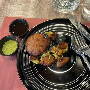 Ahloo Tikki with green chili sauce and sweet cranberry sauce