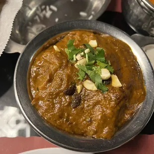 a bowl of curry and a plate of rice