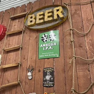 a beer sign and a ladder