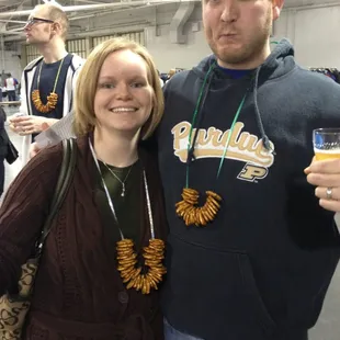Jon and Karla beer feat attendee with a pretzel necklace