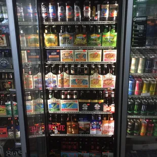 a display of beer in a cooler