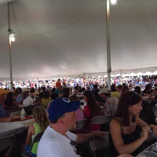 They have 2 tents of tables to sit at.