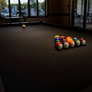 The pool table located in the downstairs clubhouse