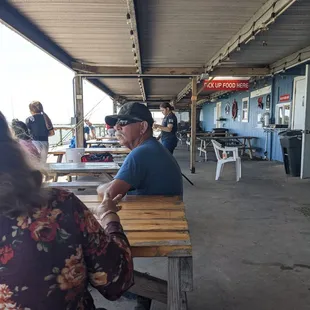 Locals enjoying sunny day at the marina.