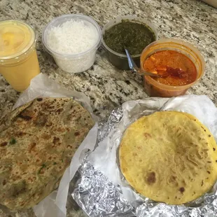 Delivery- Mango Lassi, Rice, Sarso Ka Saag, Paneer Tikka Masala, Makki ki Roti, Aloo Parantha