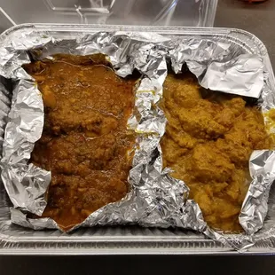 two pieces of fish wrapped in tin foil