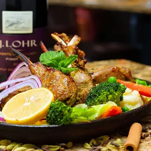 a plate of food and a bottle of wine