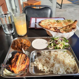 Goat curry, tandoori chicken lunch combo with mango lassi.