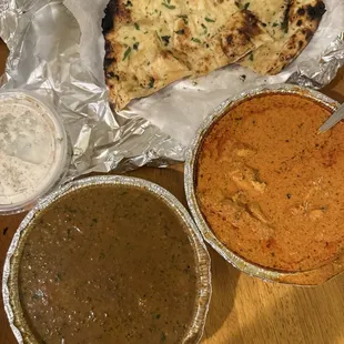 Butter chicken, yogurt side, garlic naan, daal makhni
