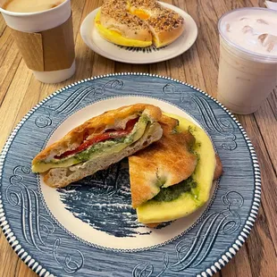 (front) pesto omelet focaccia + bacon, egg, and cheddar bagel (back)