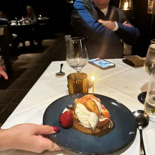 Warm butter cake with vanilla ice cream and Carmel sauce, fresh whipped cream and berries. Was delicious.