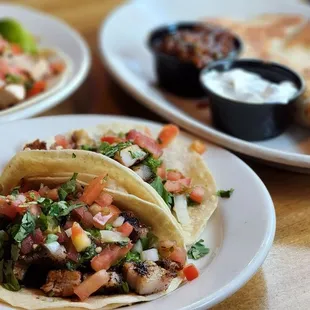 three plates of mexican food