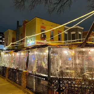 a restaurant on a city street at night