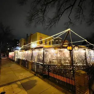 a restaurant on a city street at night