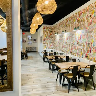 a dining area with tables and chairs