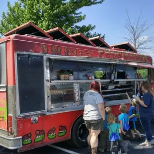 people getting food from a food truck