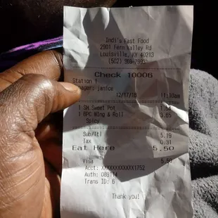 a person holding a receipt