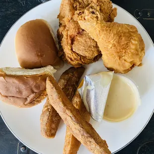 Our to go, Snack box +$4.00 2 Pieces Chicken, three 1 Wedge or any side and 1 bun 5/5 when chicken is hot -