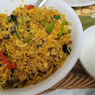 Veg Biryani with yogurt.
