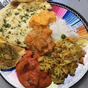 Takeout: garlic naan, paneer tikka masala, basmati rice, veggie biriani, butter chicken, veggie samosa, and karahi chicken