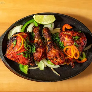 a plate of chicken and vegetables