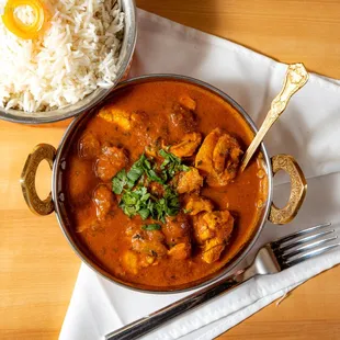 a bowl of chicken curry and rice