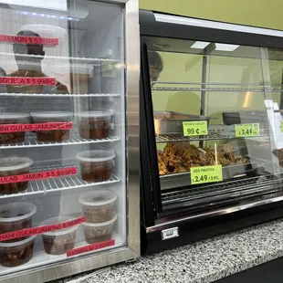 a refrigerated display of pastries
