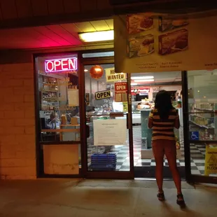 a woman standing in front of the door