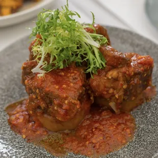 Balado Short Rib  prime beef, spicy sambal glaze, potato medallions