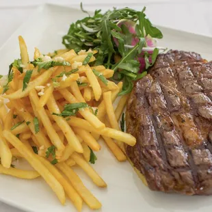 Black Pepper Ribeye  niman ranch 16oz. ribeye, garlic pepper sauce, garlic frites, arugula salad