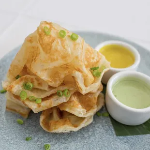 Roti Prata  crispy flat bread, yellow curry dip, green onions vegetarian available