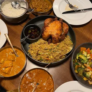 a table full of various dishes of food
