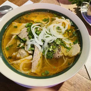 Spicy Noodle Soup Aromatic infused lemongrass broth served with slices of pork, beef brisket, pork loaf