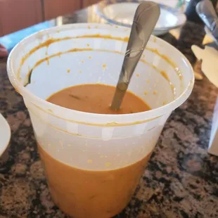 a bowl of soup with a spoon in it