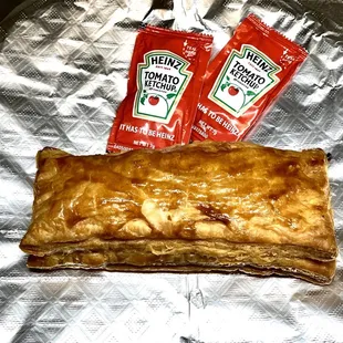 a baked pastry with ketchup