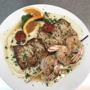 a plate of food with shrimp and vegetables