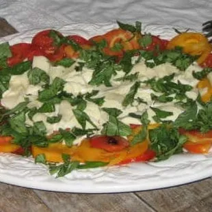 Caprese salad with heirloom tomatoes and burrata mozzarella