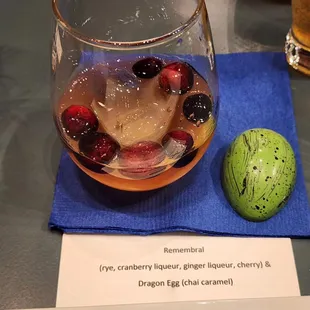 a glass of drink and an apple