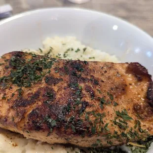 Seared salmon on grits.