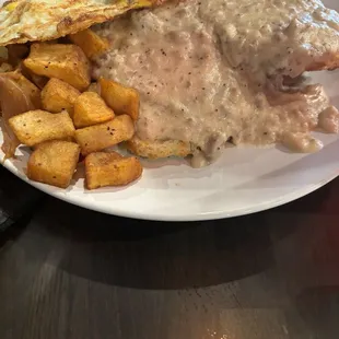 Biscuits and gravy with eggs and potatoes