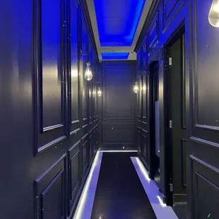 a hallway with blue lighting