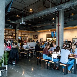 a large group of people sitting at tables