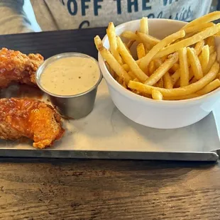 Kids chicken strips, tossed in buffalo sauce with ranch